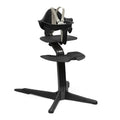 Stokke Nomi High Chair, Black - Inspires Active Sitting - Tool-Free, Seamless Adjustability - Includes Baby Set with Removable Harness for Children 6-24 Months