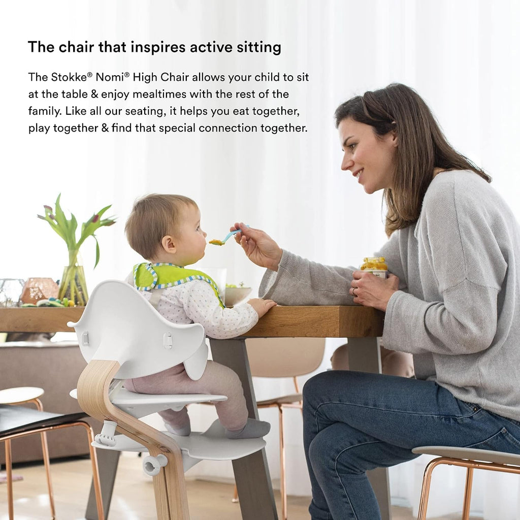 Stokke Nomi High Chair, White/Walnut - Inspires Active Sitting - Tool-Free, Seamless Adjustability - Includes Baby Set with Removable Harness for Children 6-24 Months