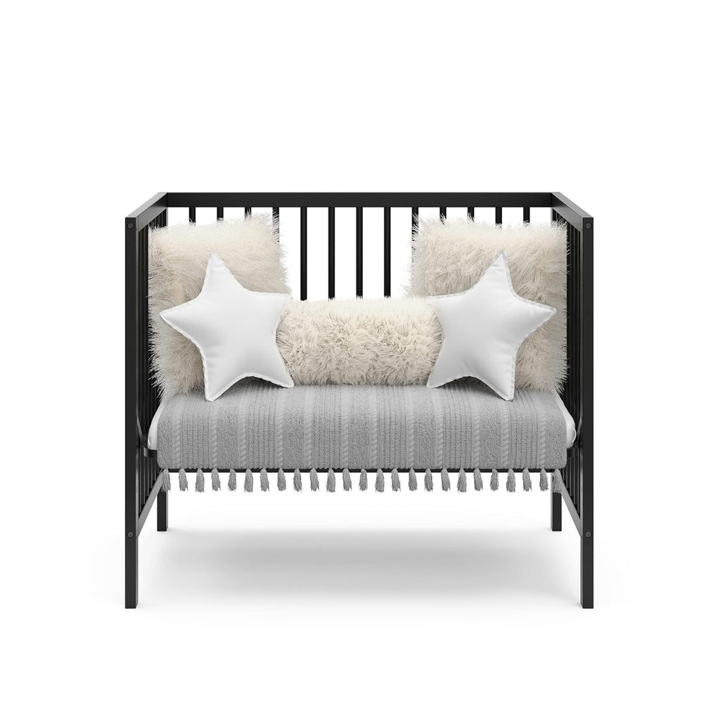 Graco Teddi 4-in-1 Convertible Mini Crib with Bonus Water-Resistant Mattress – GREENGUARD Gold Certified, 2.75-Inch Mattress Included, Small Spaces Crib, Easy 30-Minute Assembly (Black)