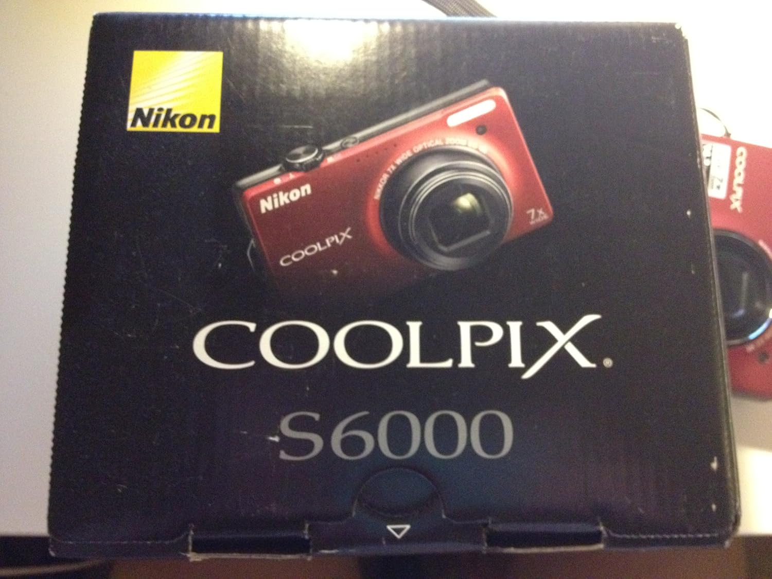 Nikon Coolpix S6000 14 MP Digital Camera with 7x Optical Vibration Reduction (VR) Zoom and 2.7-Inch LCD (Red)