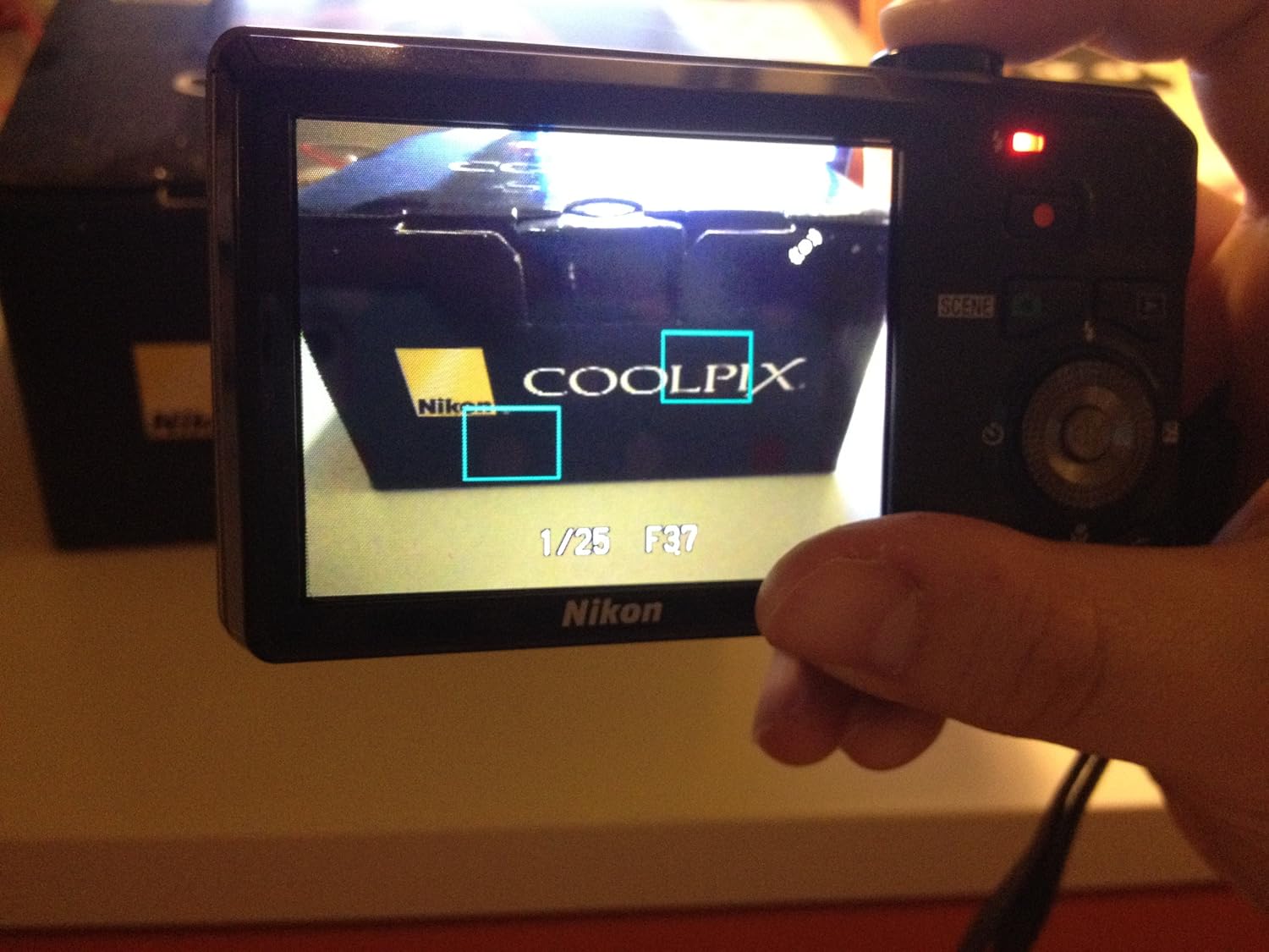 Nikon Coolpix S6000 14 MP Digital Camera with 7x Optical Vibration Reduction (VR) Zoom and 2.7-Inch LCD (Red)