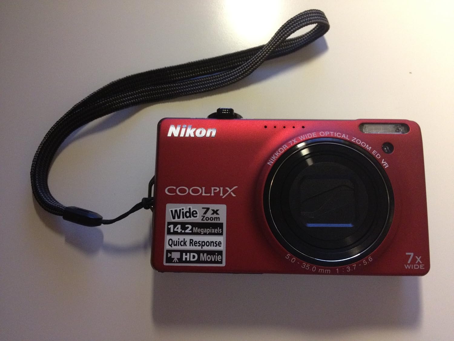 Nikon Coolpix S6000 14 MP Digital Camera with 7x Optical Vibration Reduction (VR) Zoom and 2.7-Inch LCD (Red)